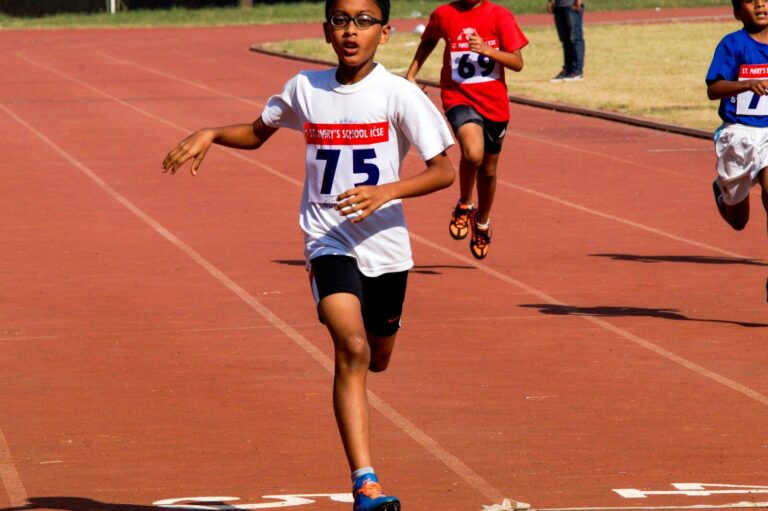 A group of children running on a track